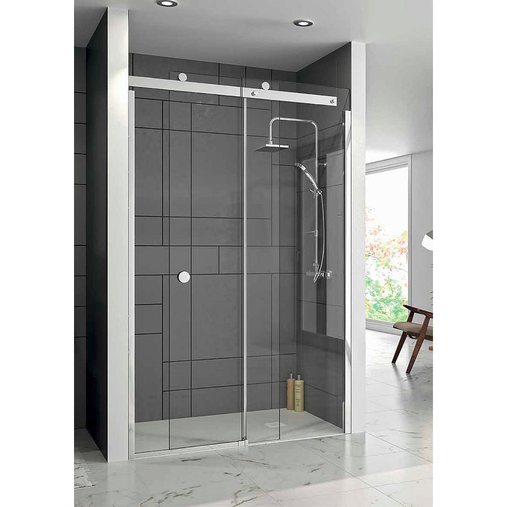 Modern glass shower enclosure with sliding door and sleek chrome fixtures.