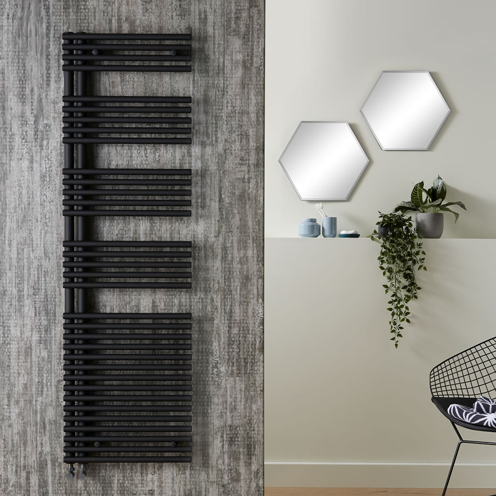 Modern bathroom with black heated towel rail and hexagonal mirrors.